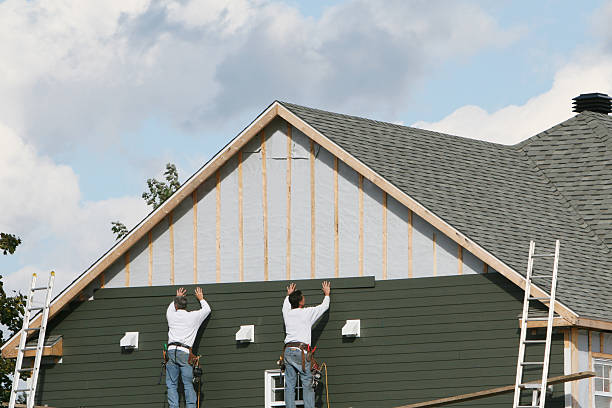 Professional Storm Damage Siding Repair technician working in Rome, NY